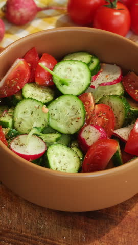 Vertical video. Cooking diet summer salad. Hands adding fresh bean sprouts to vegetable salad. Healthy vegetarian or vegan food.