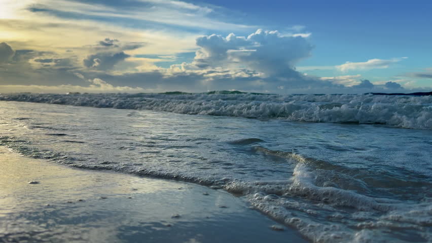 Closeup of waves washing ashore