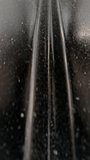A moody close-up of a dusty black corrugated metal surface showing vertical ridges, grime, and textured speckles; abstract industrial details ideal for backgrounds, design, or texture studies. - Powered by Shutterstock - Get 15% off with code: PIKWIZARD15