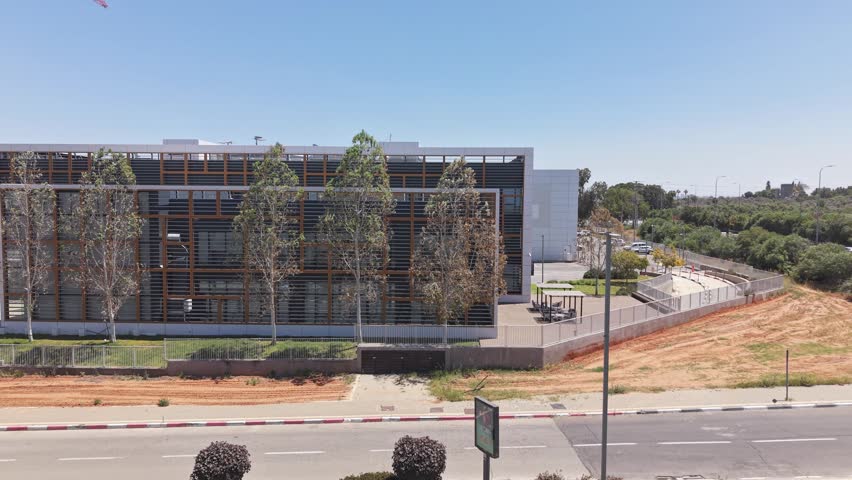 Modern office building with contemporary architecture, urban business district and clear blue sky