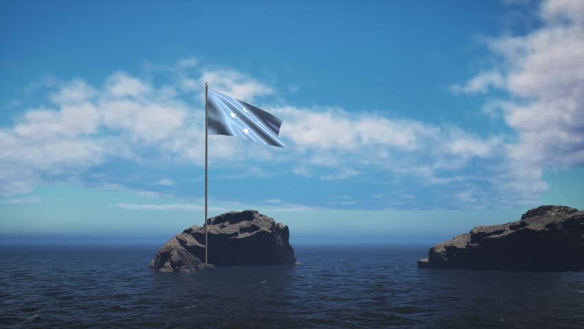 Micronesia Federated States Flag Standing In The Middle Of The Ocean Near A Rock