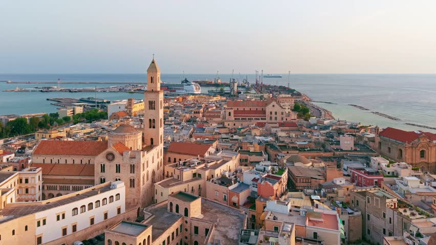 Aerial view of Bari Vecchia at sunrise. Historic old town architecture, Adriatic coast, and the Basilica of Saint Nicholas in the soft morning light of Puglia, Italy