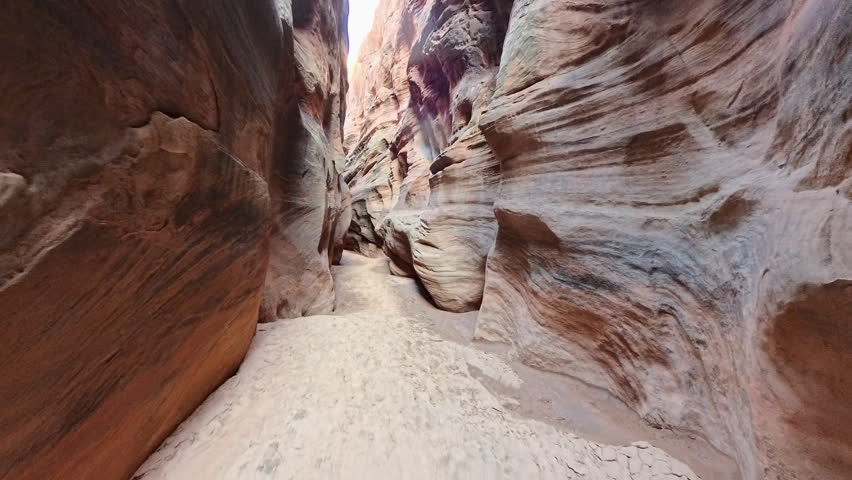 Hiking Through Red Rock Walls of Buckskin Gulch in Southern Utah