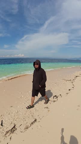 Man Walking on a Beach