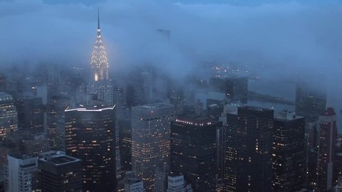 time lapse clouds over new york city at night