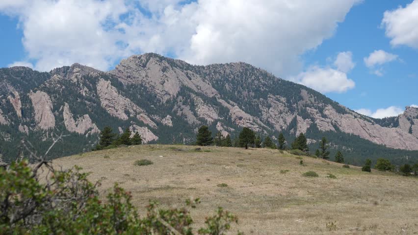 Spring Clouds Above Prairie Hills and the Flatirons near Boulder Colorado, 4K Video