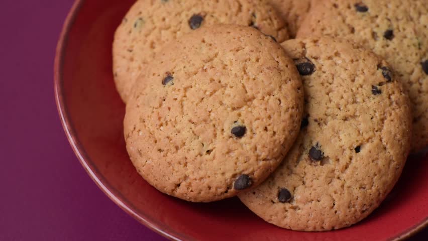 Food, oatmeal chocolate raisin cookies, dessert or breakfast pastry. Oatmeal chocolate cookies as a food background for your design