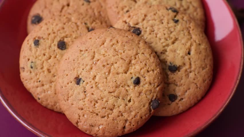 Food, oatmeal chocolate raisin cookies, dessert or breakfast pastry. Oatmeal chocolate cookies as a food background for your design