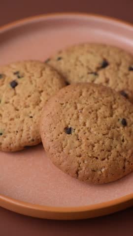 Food, oatmeal chocolate raisin cookies, dessert or breakfast pastry. Oatmeal chocolate cookies as a food background for your design