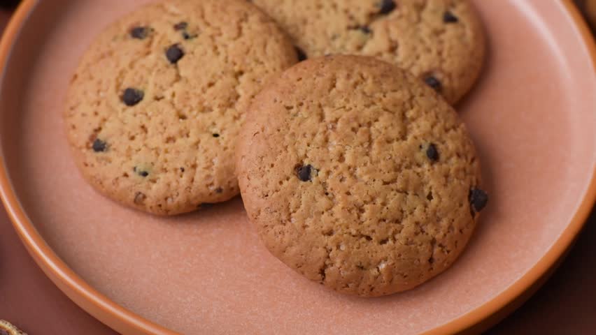 Food, oatmeal chocolate raisin cookies, dessert or breakfast pastry. Oatmeal chocolate cookies as a food background for your design