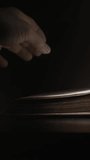 Archivist Fingers Resting On Antique Ledger Pages, Careful Closeup Under Low Light Emphasizing Texture, - Powered by Shutterstock - Get 15% off with code: PIKWIZARD15