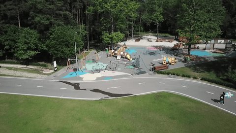 Backward Ascending Drone Flight over Park