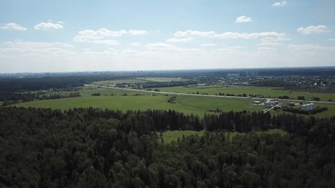 Forward Smooth Drone View over Fields Highway
