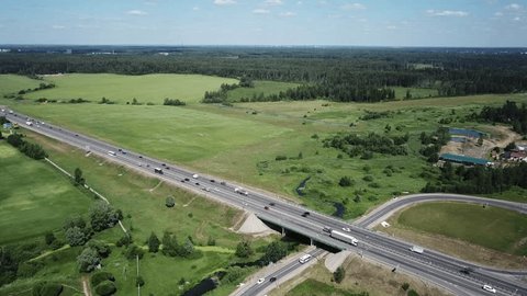 Forward Smooth Aerial over Highway through Countryside