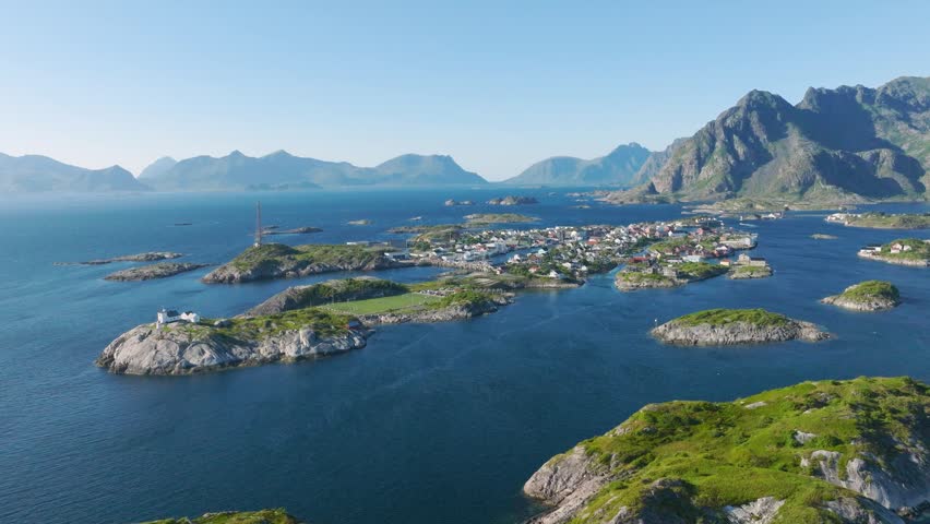 Aerial drone view of Henningsvaer village, Lofoten islands, Norway. Scenic summer video with mountains, islands and ocean. Scenic view. Travel and arctic nature in Scandinavia.