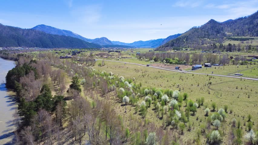 Vast Lush Scenery. Beautiful Hills And Mountain Vista. Expansive Grassy Hills With Scenic Mountain Views. Wideranging Landscape Showing Green Valleys And Tall Mountain Ridges