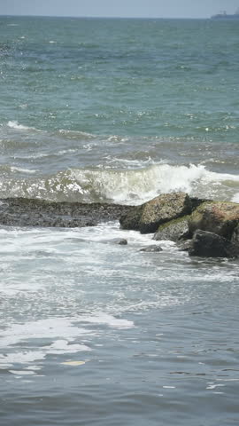 Sea Waves Breaking on Rocks at Uswetakeiyawa Beach, Kandana, Sri Lanka.