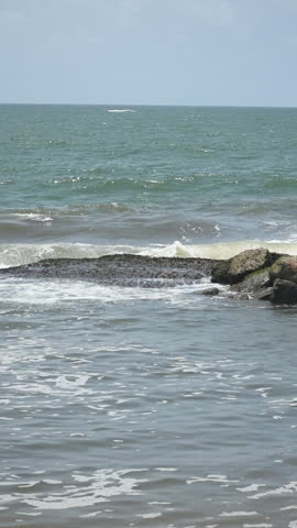 Sea Waves Breaking on Rocks at Uswetakeiyawa Beach, Kandana, Sri Lanka.