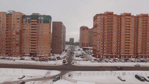 Aerial Drone Pullback over Snowy Residential Area