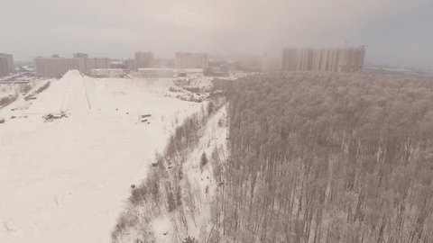Aerial Drone Flight Over Snowy Forest