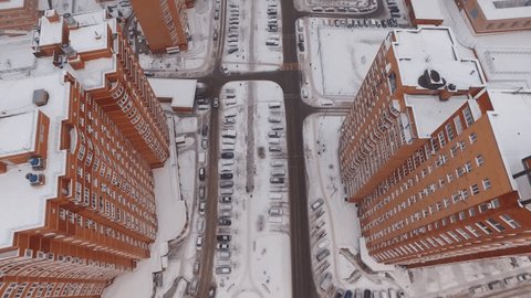 Drone Ascending from City Streets to Quarry