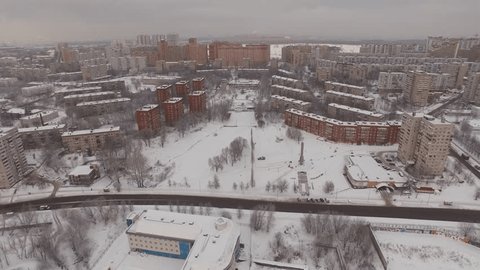 Aerial Drone Flight Over Snowy Residential Houses
