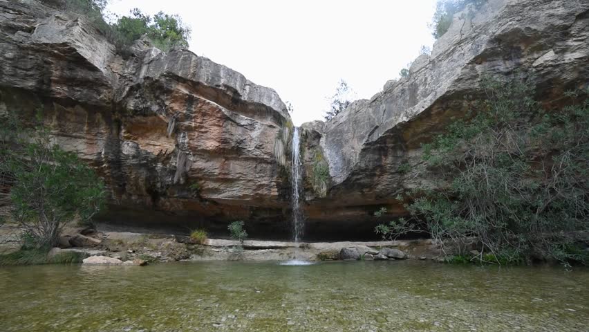 Stunning Waterfall in Chella Spain Descending Over Massive Rock Wall, Nature Water Flow Footage