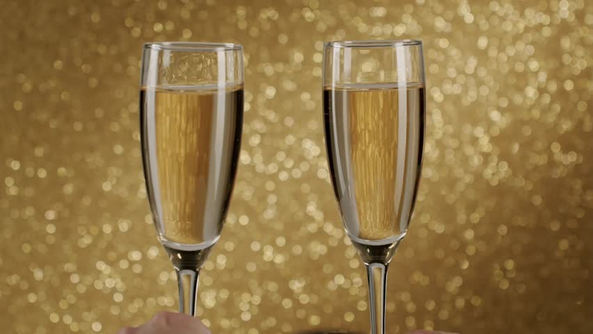 Beautiful slow-motion clip of two glasses of champagne clinking together isolated background, creating an elegant splash and celebrating a special anniversary occasion.