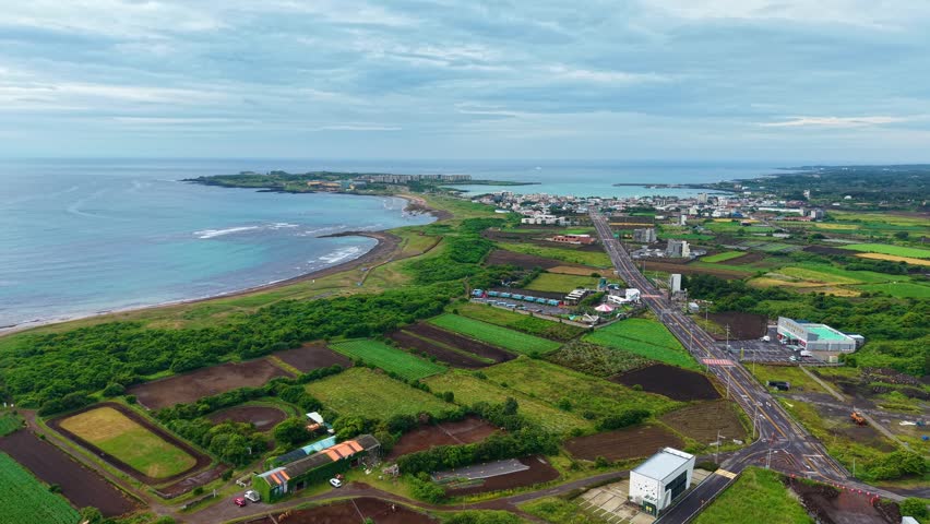 Aerial drone landscape view of Jeju Island countryside village and coastal scenery in South Korea