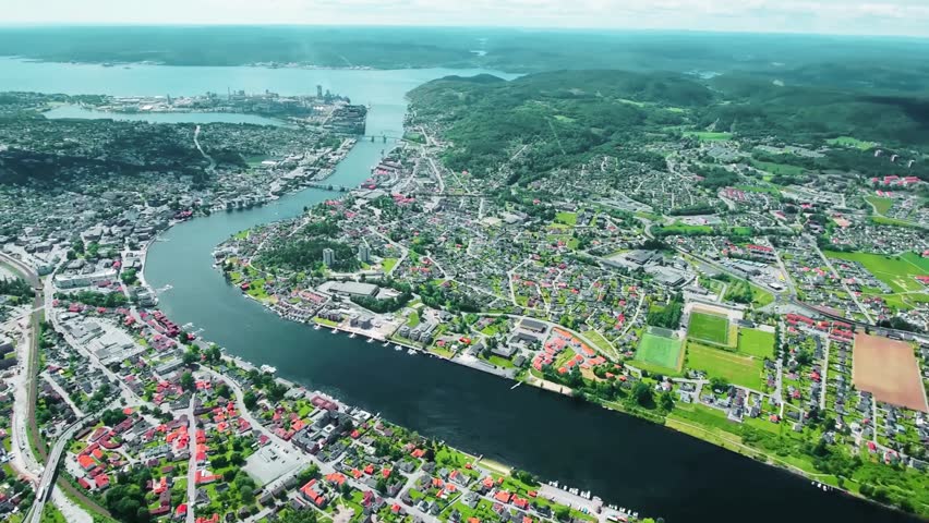 Aerial view of Bergen, a coastal city on Norway’s west coast, showcasing colorful harbor buildings, surrounding mountains, and scenic fjords. June 15, 2024, highlights the city’s natural harbor setting and cultural importance as Norway’s second-largest city.