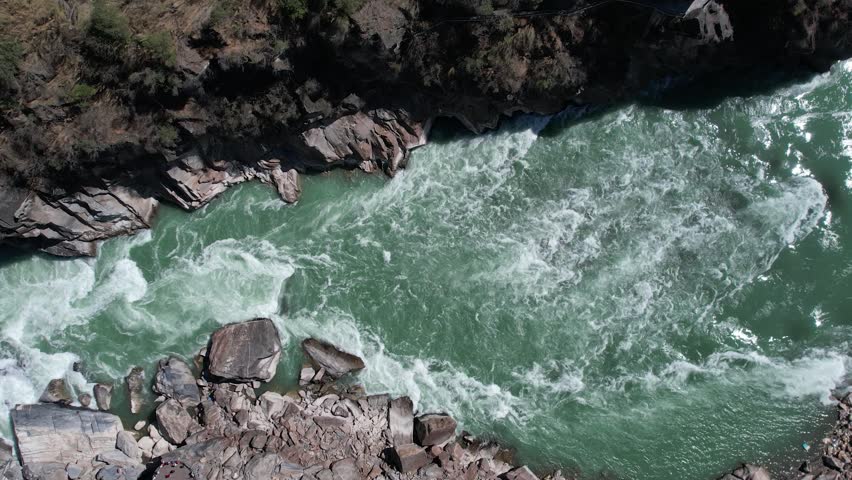 4K aerial video overlooking the river water of Jinsha River Tiger Leaping Gorge
