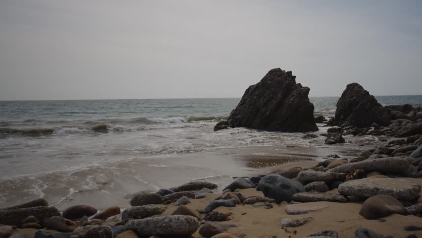Waves breaking on the shore