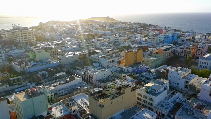 Drone video of Old San Juan, Puerto Rico with El MOrro castle on the background during sunset. 