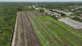 Aerial View Of Flooded Farmland With Greenhouses And Suburban Housing Near Plantation. - Powered by Shutterstock - Get 15% off with code: PIKWIZARD15
