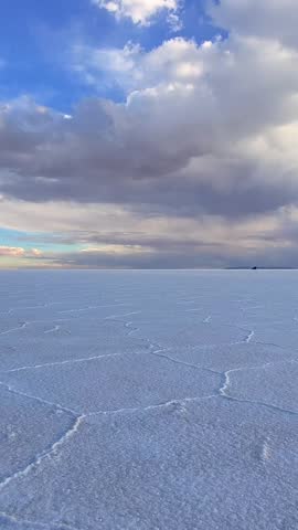 Salar de Uyuni Salt Flat Landscape under Cloudy Sky in Bolivia