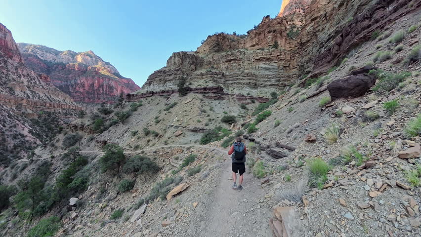 Following Man Backpacking into the Grand Canyon on the North Kaibab Trail