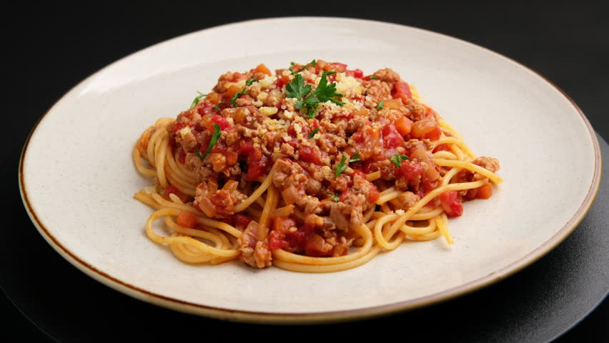 Spaghetti with minced pork in tomato sauce, pasta with a meat based bolognese tomatoes