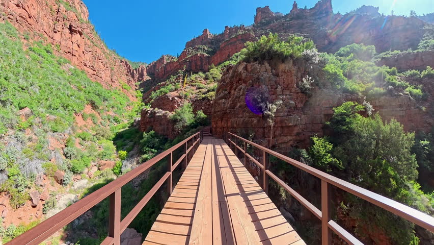 Hiking Over Bridge to Trail through the Grand Canyon