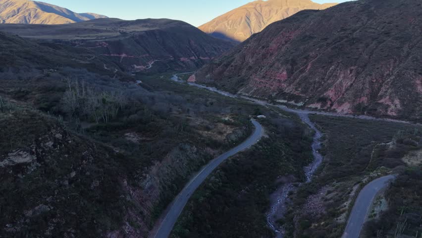 Scenic hiking trails winding through mountains in a rural landscape surrounded by hills and valleys.