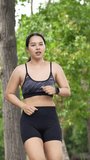 Young athletic woman catching her breath and checking her heart rate on a smartwatch after running - Powered by Shutterstock - Get 15% off with code: PIKWIZARD15