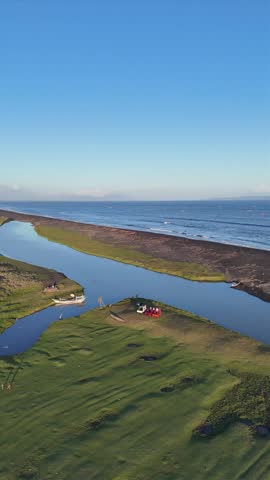 Aerial Drone View of Savanna Landscape with River Flowing Along the Coast