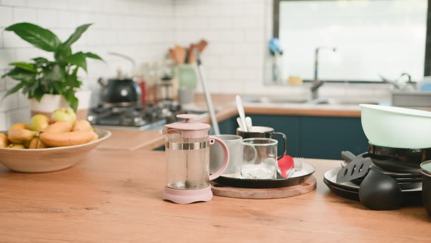 Messy Kitchen Countertop With Dirty Dishes After a Meal, Ready for Washing
