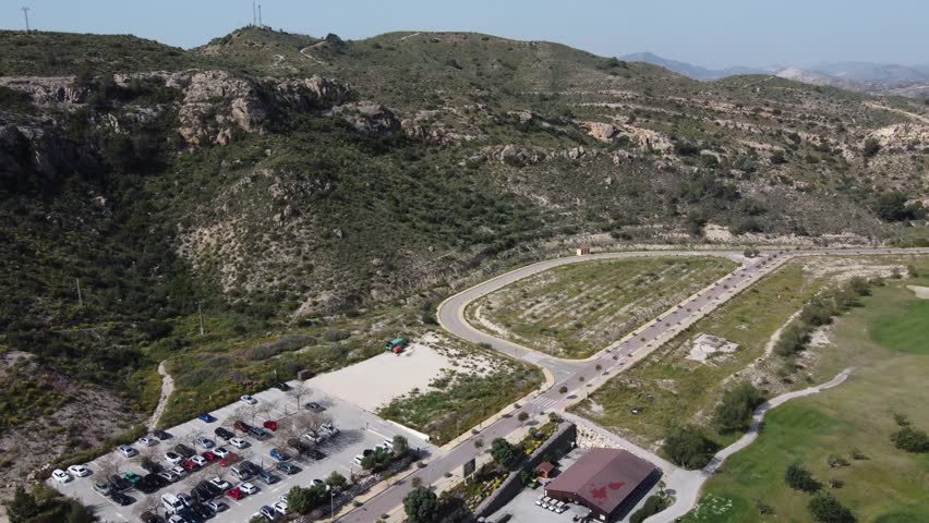 Aerial reveal of the club house at Font del Llop golf course. Alicante, Spain.