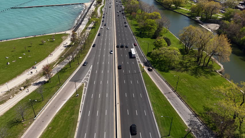 Revealing Drone Shot of Chicago Cityscape Skyline, Illinois USA, Lake Michigan, Lake SHore Drive Traffic and Downtown Skyscrapers