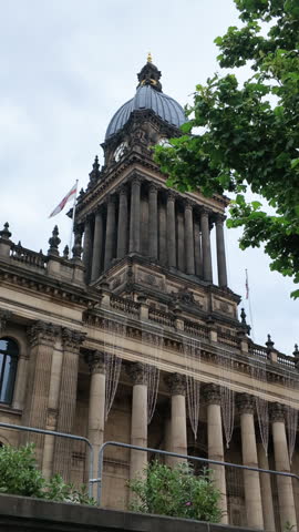 Leeds Town hall clock tower with England Flag flying. Vertical.