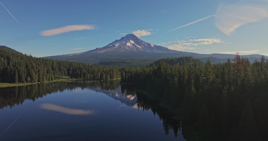 Aerial shot of Trillium Lake in the forest reflecting Mount Hood on the calm surface in Oregon, USA