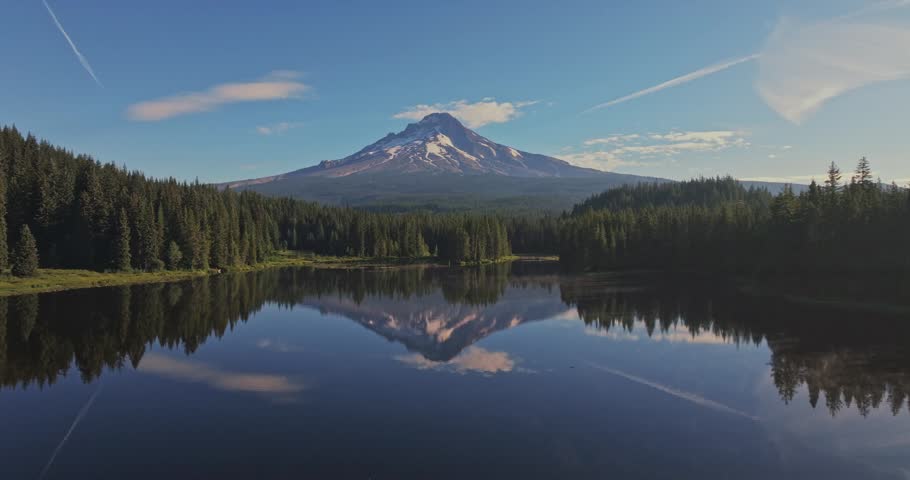 Aerial shot of Trillium Lake in the forest reflecting Mount Hood on the calm surface in Oregon, USA