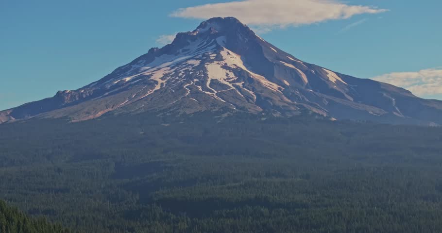 Aerial shot of Trillium Lake in the forest reflecting Mount Hood on the calm surface in Oregon, USA