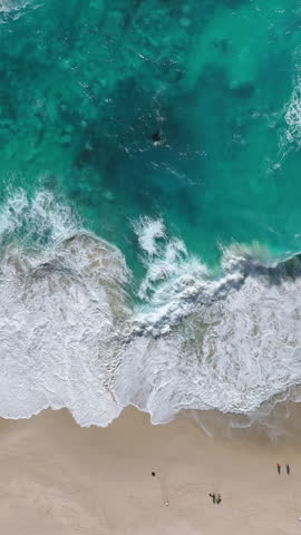 Aerial view of Kelingking Beach in Nusa Penida island, Bali in Indonesia. Vertical.