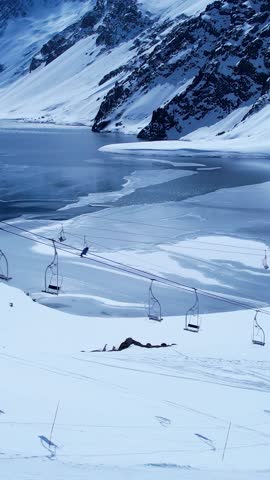 Santiago Chile. Ski station center at snowing Andes Mountains near Santiago Chile. Snow mountain landscape at winterness. Winter ness travel destination. Winter ness tourism travel.